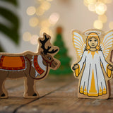 Lanka Kade Christmas angel toy with yellow and white dress, wings and halo next to a Lanka Kade reindeer with Christmas reins and seat.