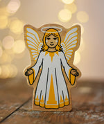 Lanka Kade Christmas angel toy with yellow and white dress, wings and halo.