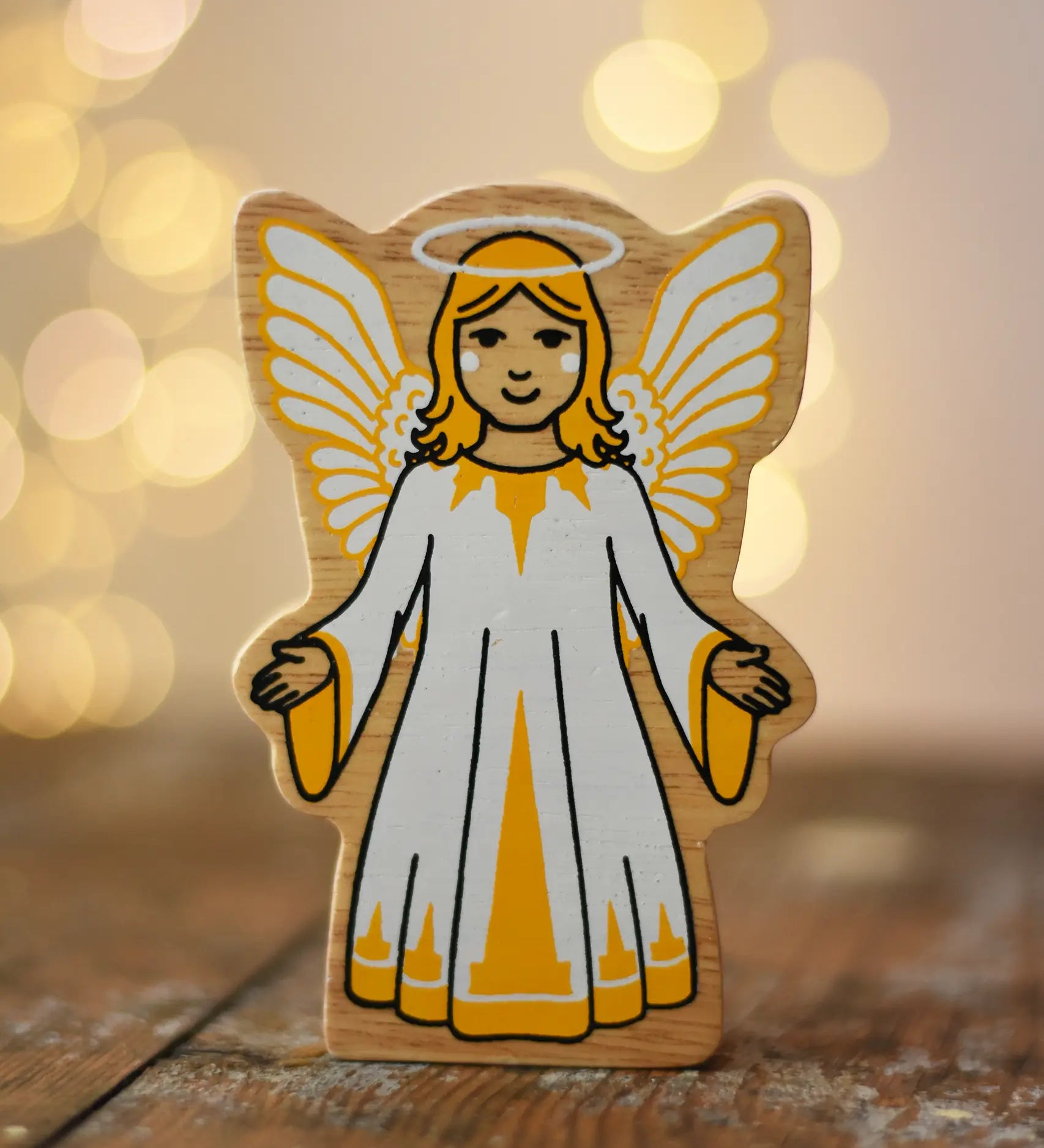 Lanka Kade Christmas angel toy with yellow and white dress, wings and halo.