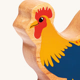A close up of the chunky wooden Lanka Kade blue cockerel wooden figure available at Babipur.