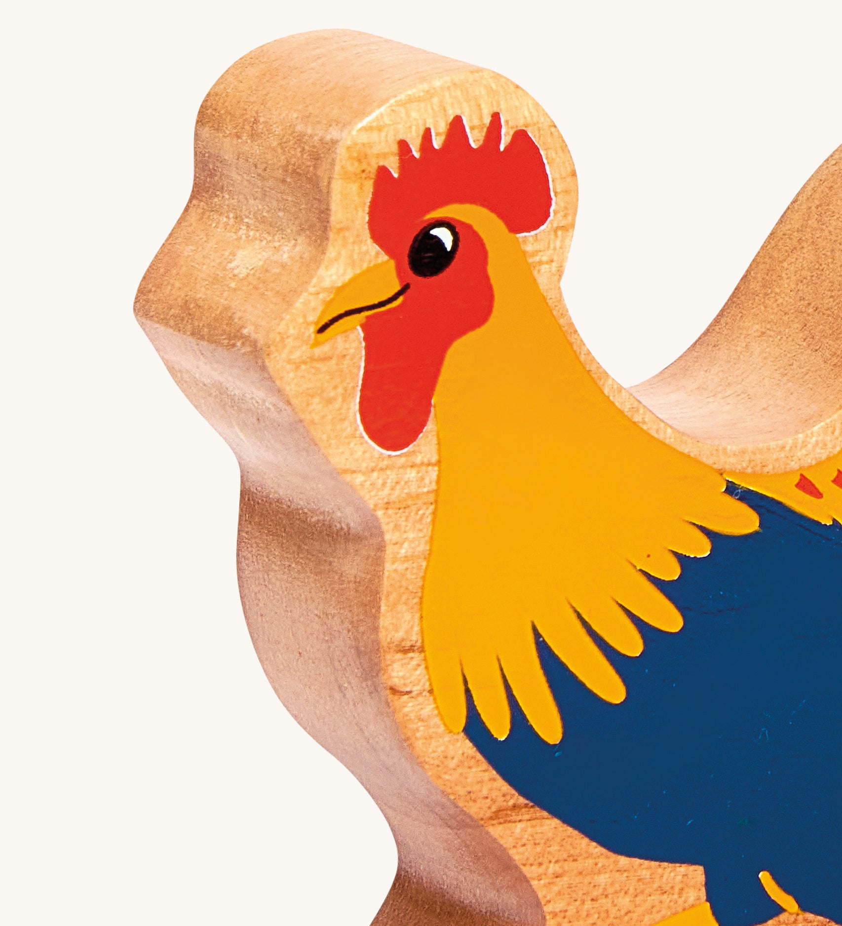 A close up of the chunky wooden Lanka Kade blue cockerel wooden figure available at Babipur.