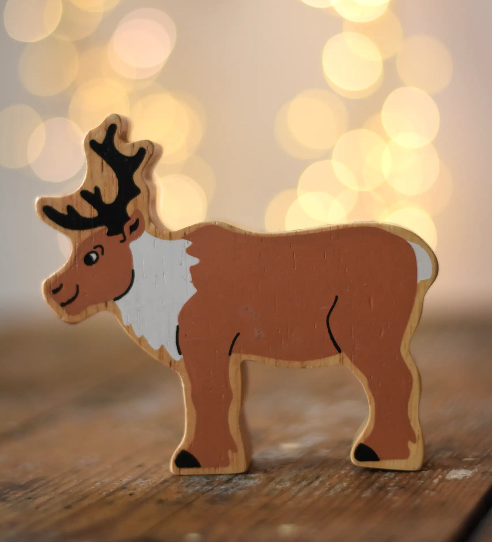 Lanka Kade Christmas reindeer toy, a wooden figure printed on both sides.