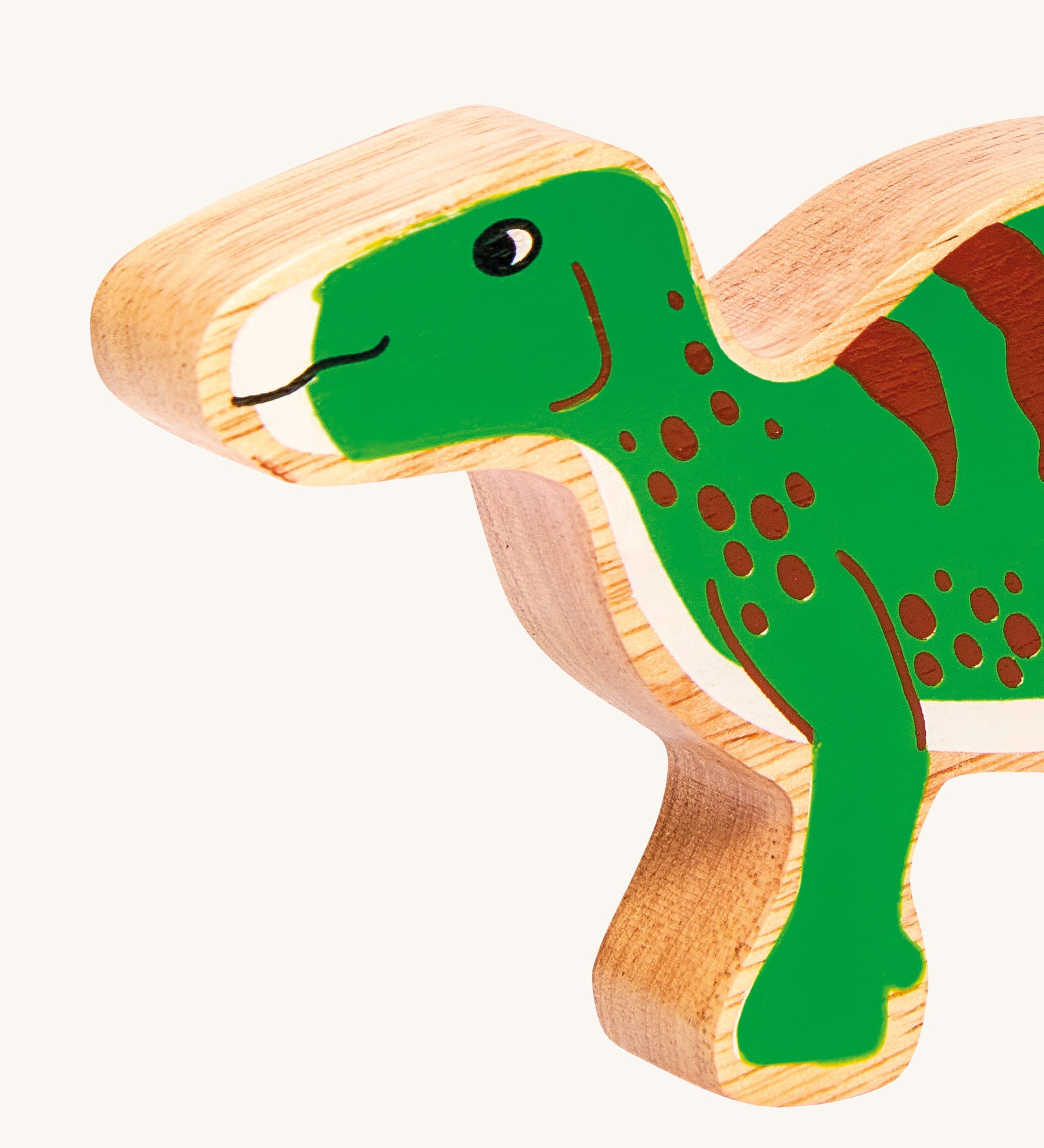 A close up of the Lanka Kade Iguanodon figure available at Babipur. A chunky wooden figure in a shape of a Iguanodon. 