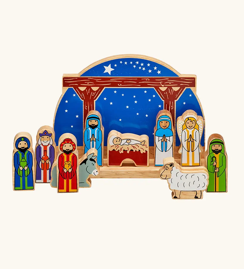 Lanka Kade wooden Nativity scene toy set featuring colorful painted wooden figures of animals and biblical characters, arranged in front of a wooden stable.