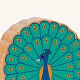 A close up of the chunky wooden Lanka Kade figure of a standing peacock and available at Babipur.