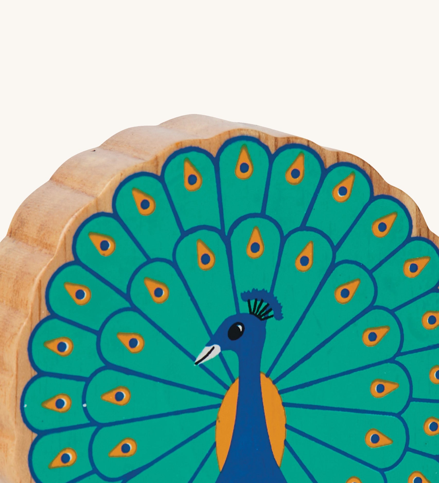A close up of the chunky wooden Lanka Kade figure of a standing peacock and available at Babipur.