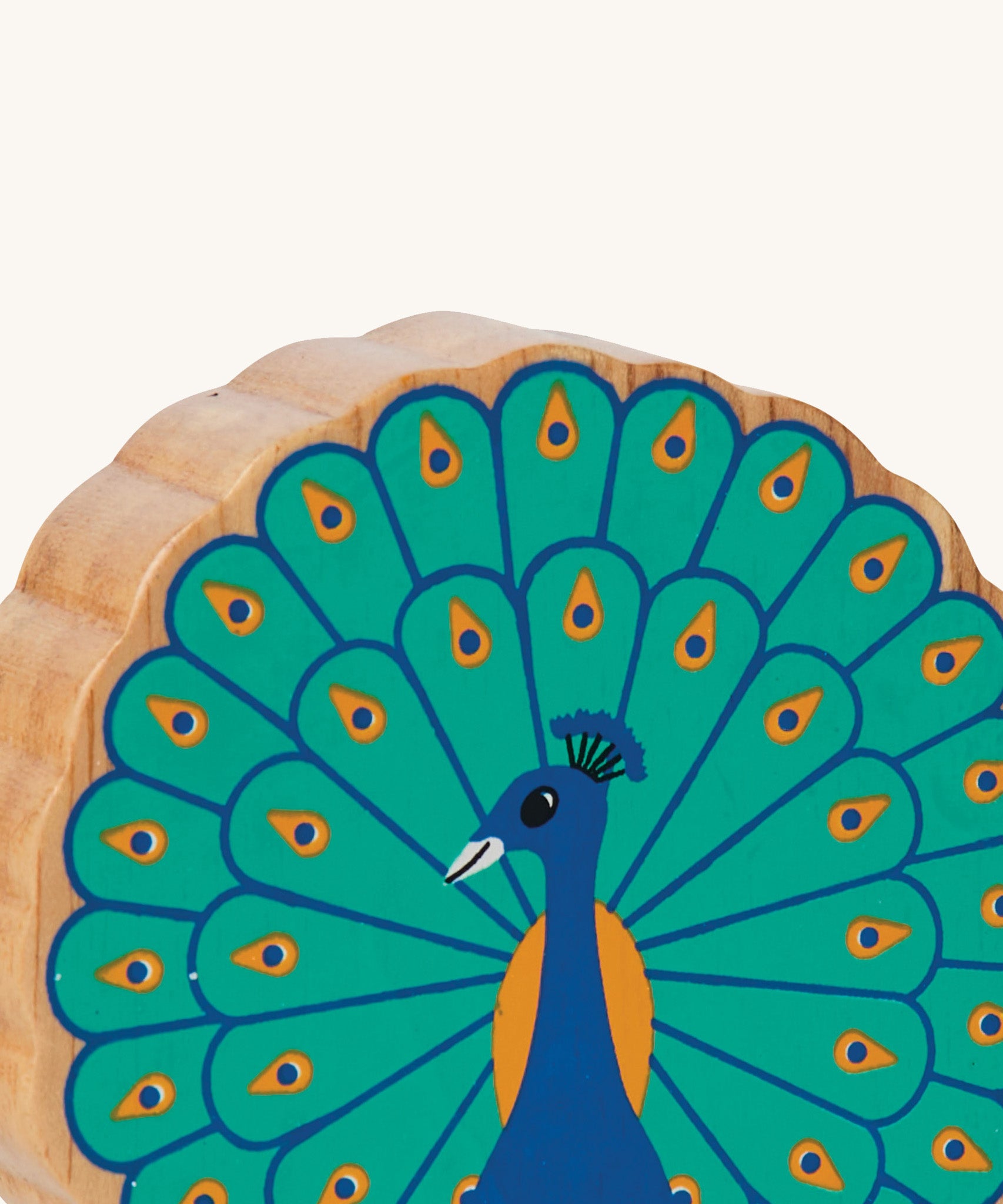 A close up of the chunky wooden Lanka Kade figure of a standing peacock and available at Babipur.