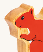 A close up of the chunky wooden Lanka Kade red squirrel animal figure available at Babipur. 