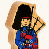 Lanka Kade wooden Scottish bagpiper figure toy showing close up of painted facial and outfit detail