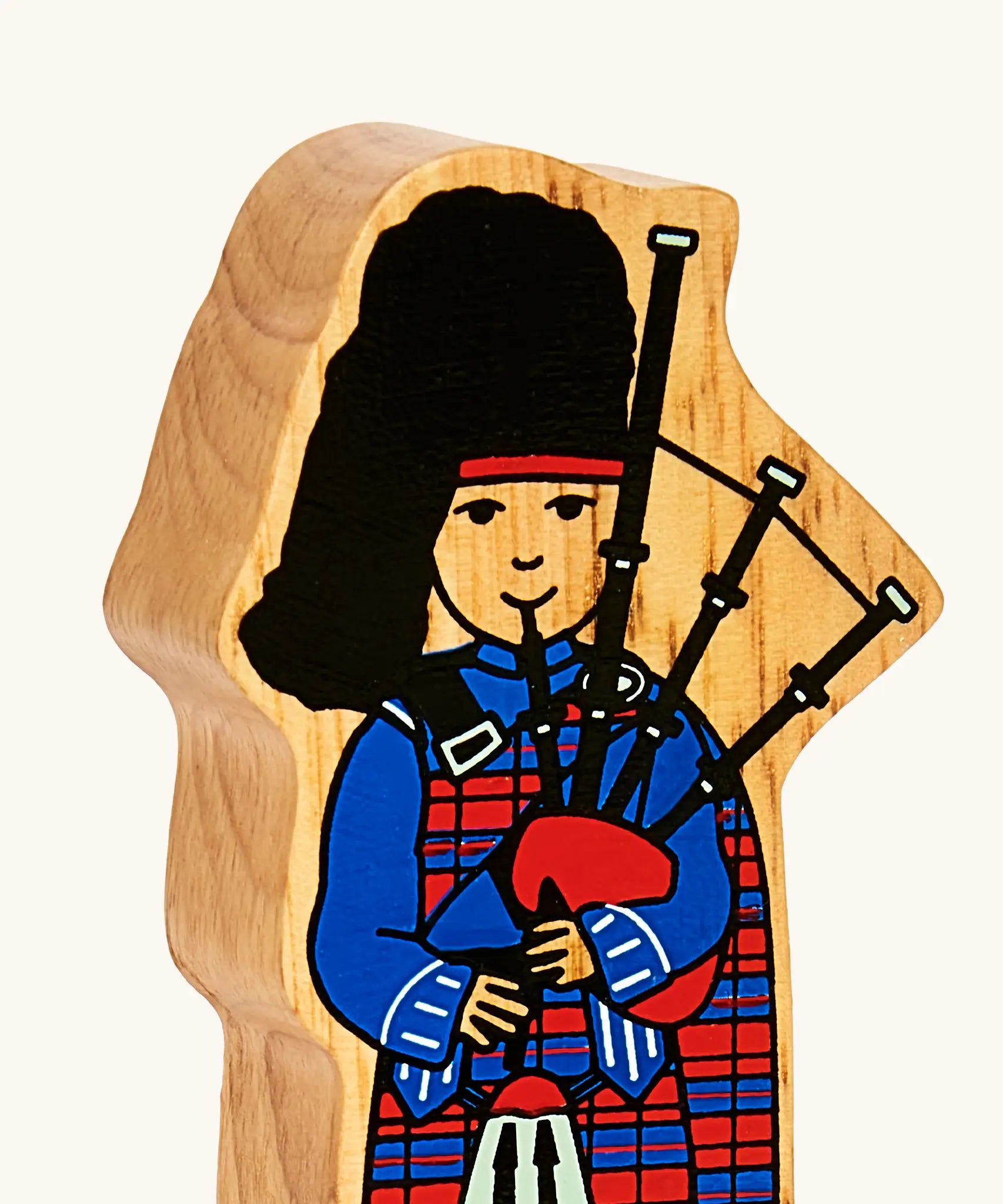 Lanka Kade wooden Scottish bagpiper figure toy showing close up of painted facial and outfit detail