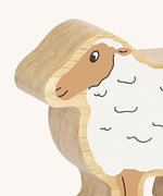 A close up of the chunky wooden Lanka Kade white sheep figure available at Babipur.
