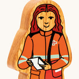 A close up of the chunky wooden Lanka Kade black and orange delivery woman figure available at Babipur.