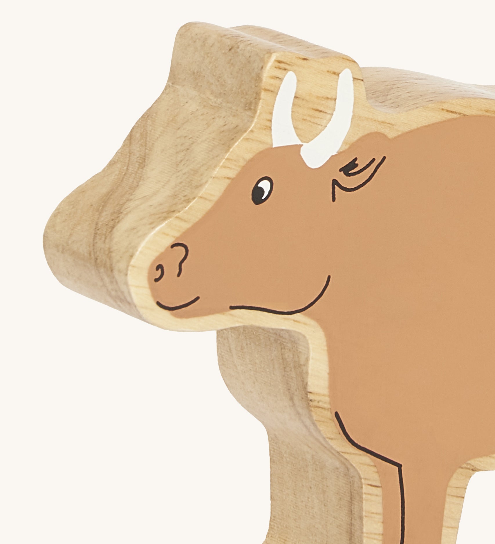 A close up of the chunky wooden Lanka Kade brown ox animal figure available at Babipur showing its facial features
