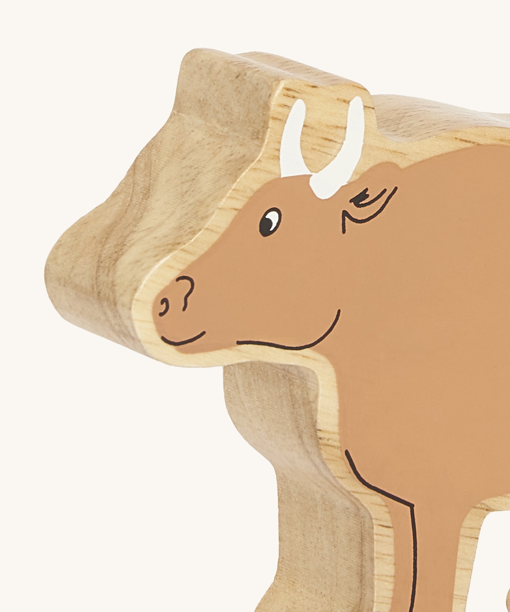 A close up of the chunky wooden Lanka Kade brown ox animal figure available at Babipur showing its facial features