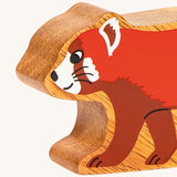 A close up of the chunky wooden Lanka Kade red panda animal figure available at Babipur.