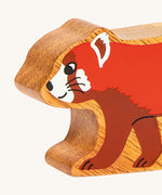 A close up of the chunky wooden Lanka Kade red panda animal figure available at Babipur.