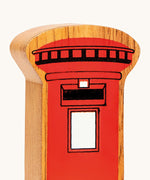 A close up of the chunky wooden Lanka Kade red post box figure available at Babipur.