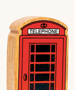 A close up of the chunky wooden Lanka Kade red telephone box figure available at Babipur.