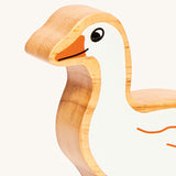 A close up of the chunky wooden Lanka Kade white goose animal figure available at Babipur showing its facial features