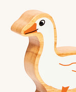 A close up of the chunky wooden Lanka Kade white goose animal figure available at Babipur showing its facial features