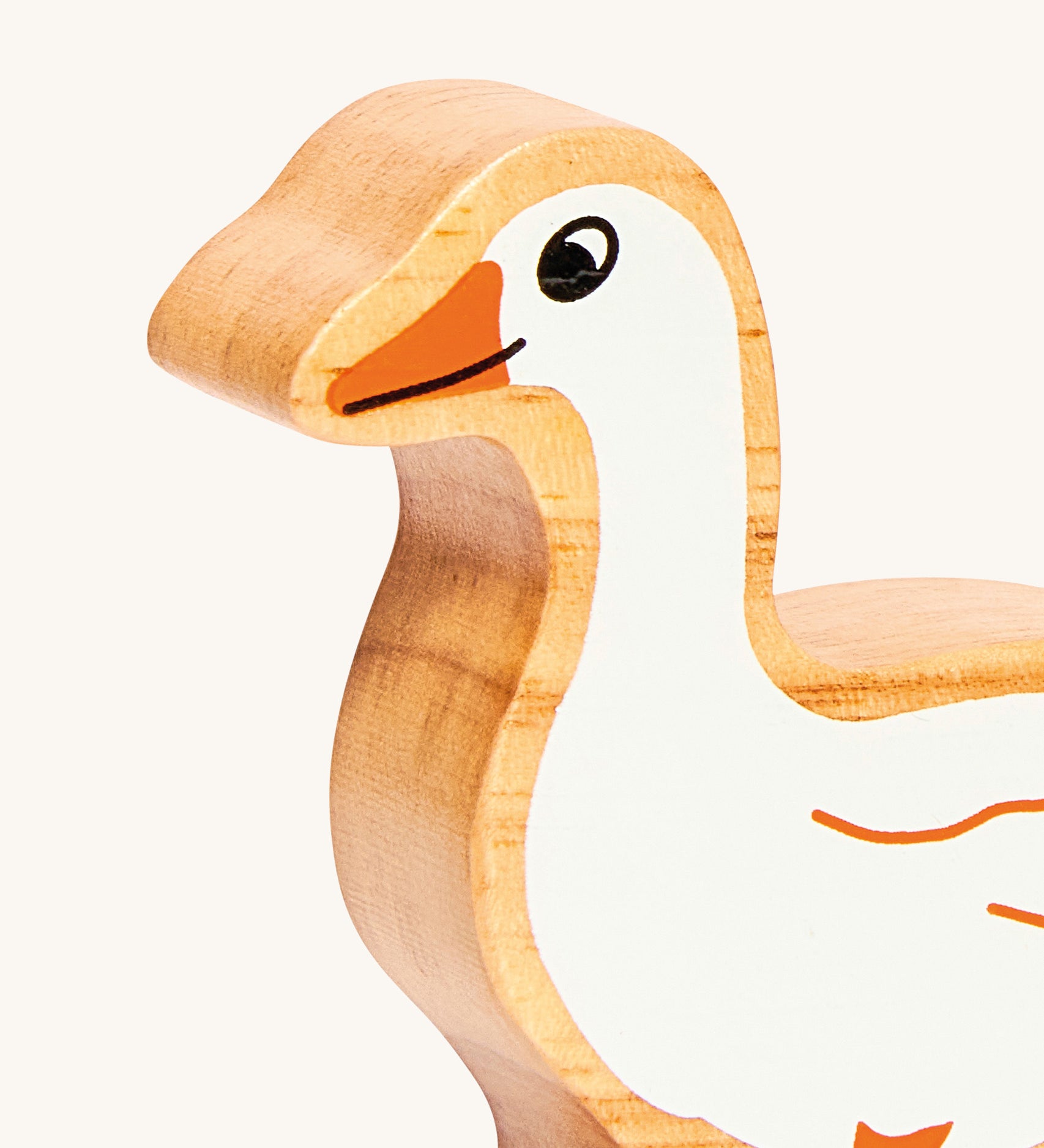 A close up of the chunky wooden Lanka Kade white goose animal figure available at Babipur showing its facial features