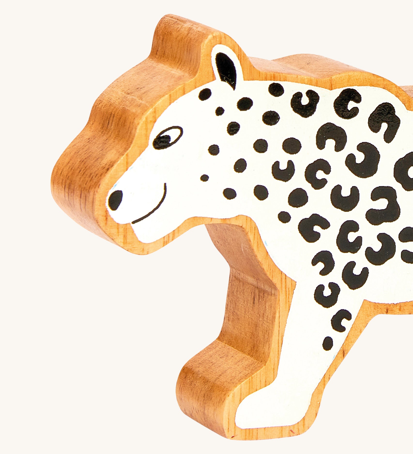 A close up of the chunky wooden Lanka Kade white snow leopard animal figure available at Babipur.