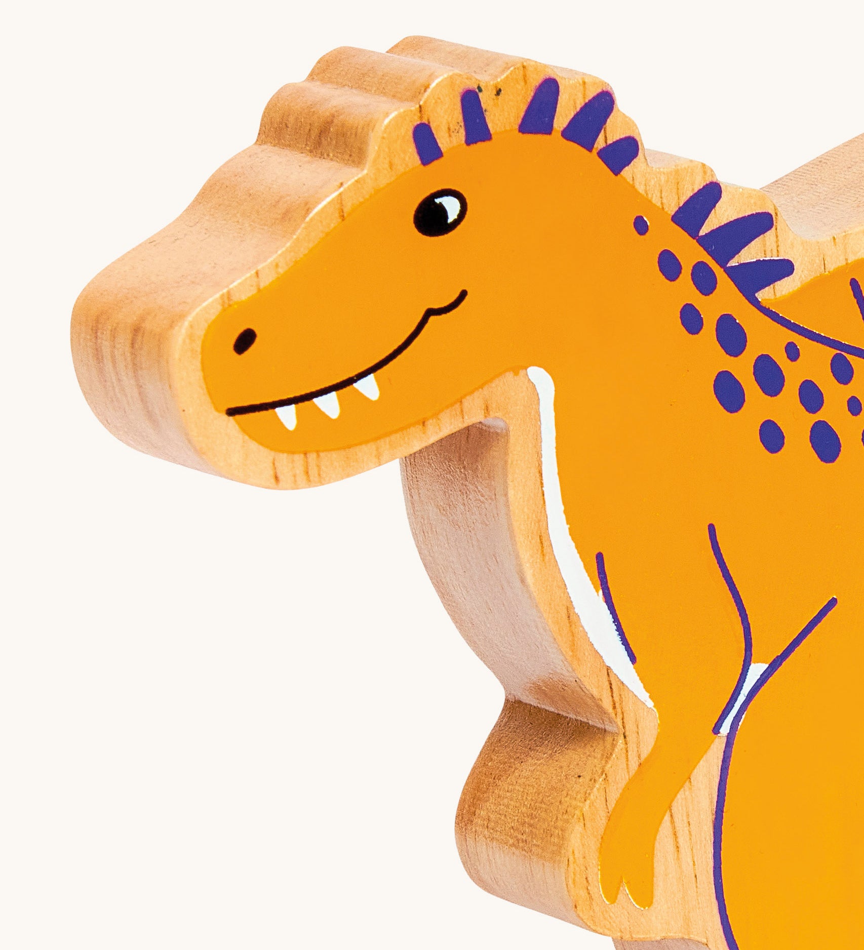 A close of the chunky wooden Lanka Kade yellow Becklespinax dinosaur figure available at Babipur.