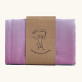 Laura's play cotton pastel rainbow extra large play cloth made from 100% organic cotton held by a decorated cardboard strip