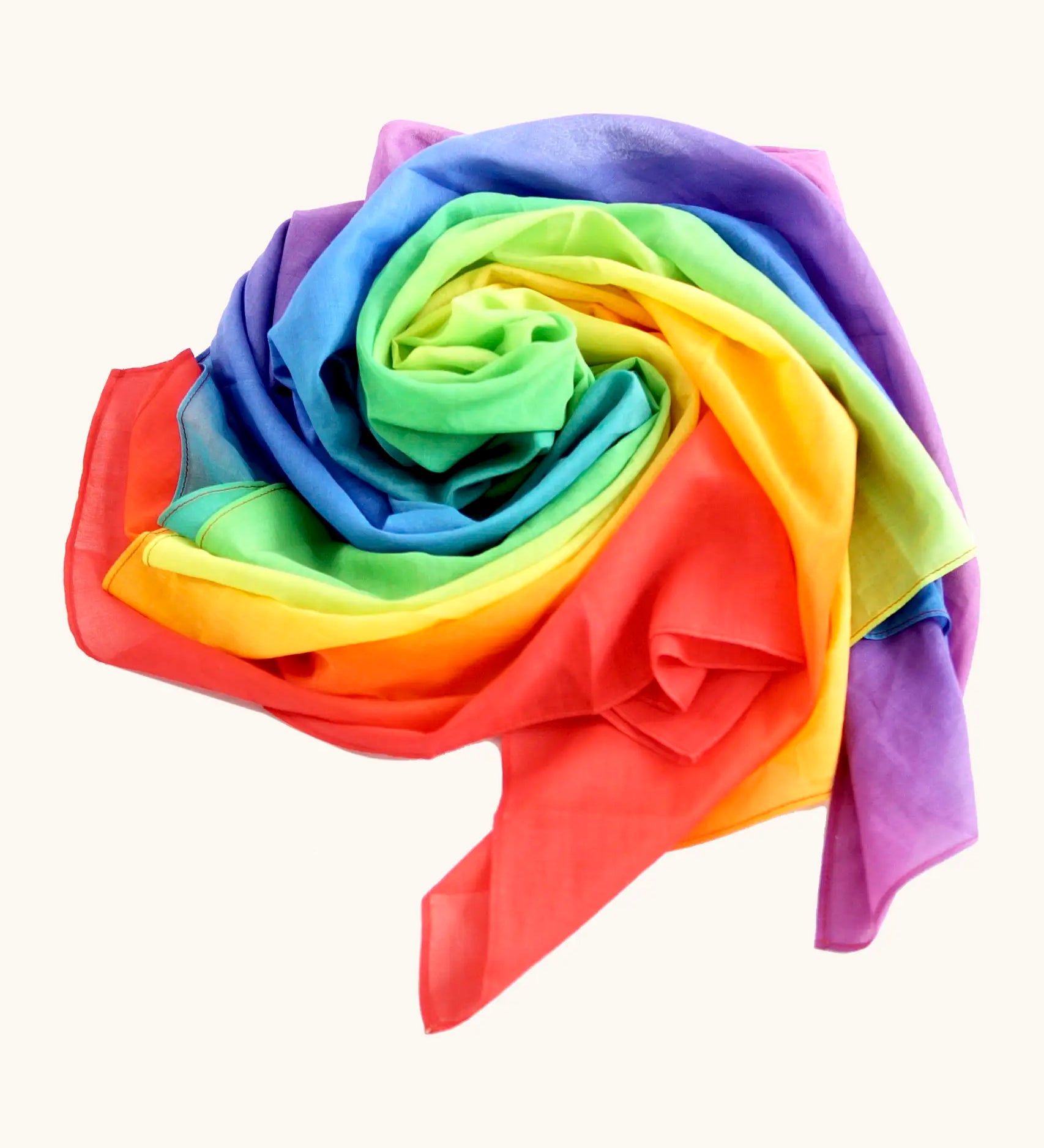 Laura's play cotton bright rainbow play cloth made from 100% organic cotton laid flat in a swirl