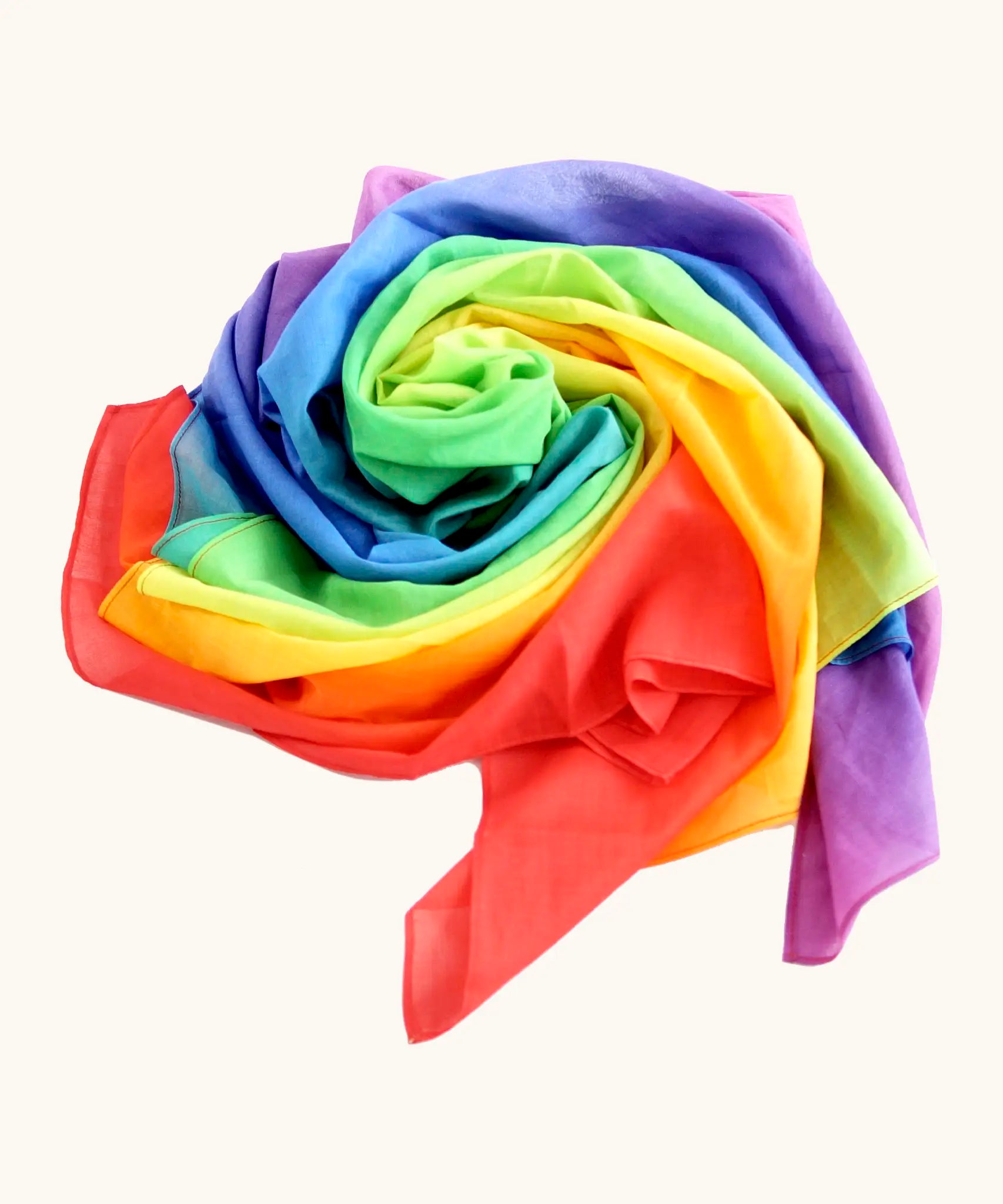 Laura's play cotton bright rainbow play cloth made from 100% organic cotton laid flat in a swirl