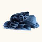 Dark blue 100% organic cotton play cloth ruffled up into a pile