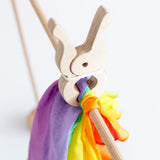 Laura's play cotton bright rainbow play cloth made from 100% organic cotton held by a wooden peg