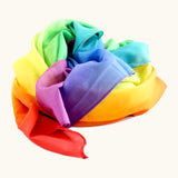 Laura's play cotton bright rainbow play cloth made from 100% organic cotton ruffled up into a pile
