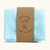 Laura's 100% organic cotton play cloth in light blue held together by a decorated cardboard strip
