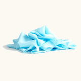 Lauras play cotton play cloth in light blue, made from 100% organic cotton, 90cm square, ruffled up into a pile.