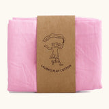 Laura's 100% organic cotton play cloth in pink held together by a decorated cardboard strip