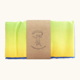 Laura's 100% organic cotton play cloth in a rainbow gradient held together by a decorated cardboard strip