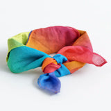 Laura's play cotton bright rainbow play cloth made from 100% organic cotton tied in a knot