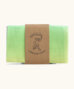 Laura's play cotton pastel rainbow play cloth made from 100% organic cotton held by a decorative cardboard strip