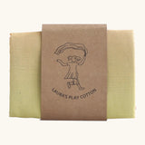 Laura's play cotton pastel rainbow large play cloth made from 100% organic cotton held by a decorated cardboard strip