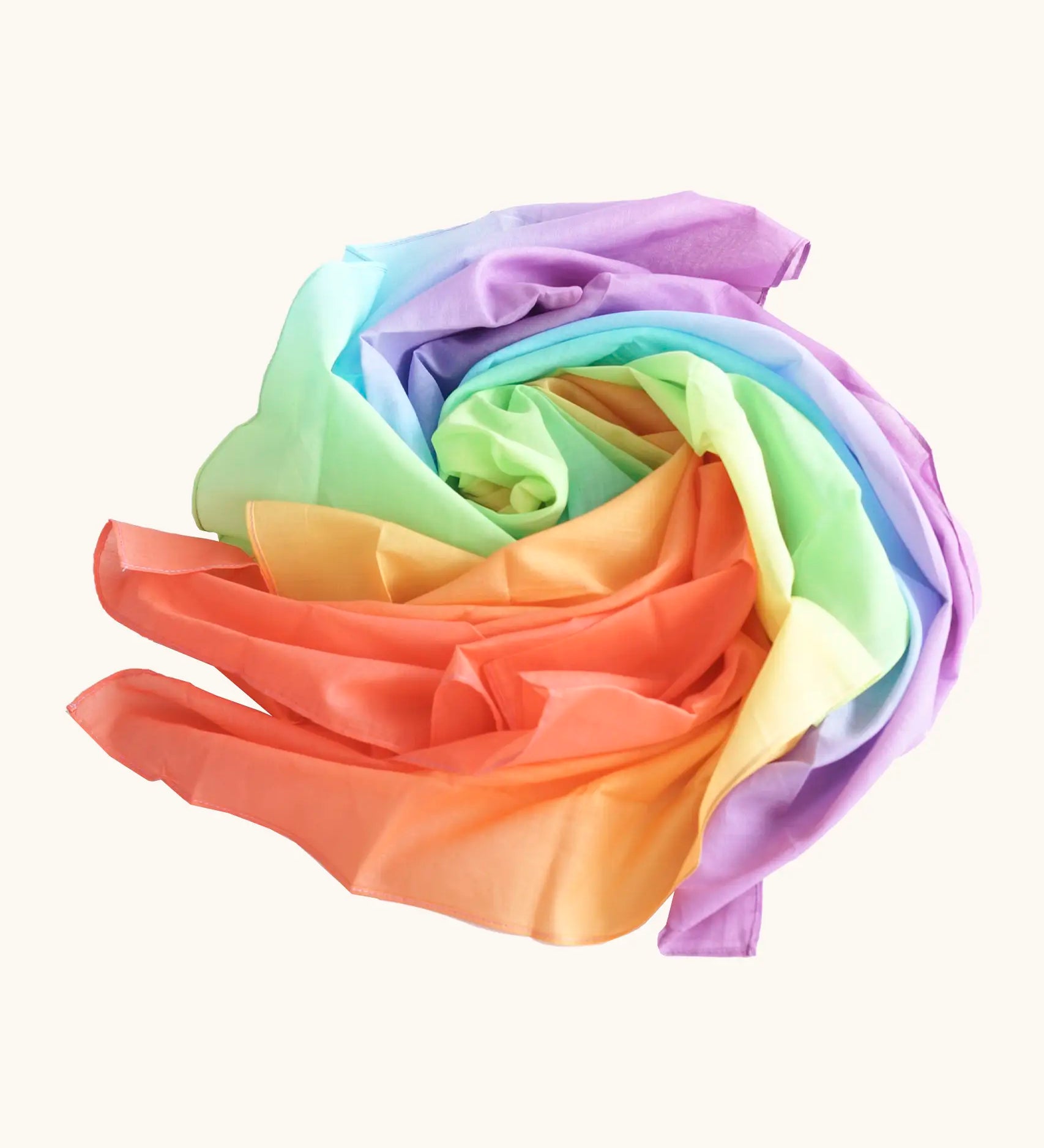 Laura's play cotton pastel rainbow play cloth made from 100% organic cotton ruffled up into a pile