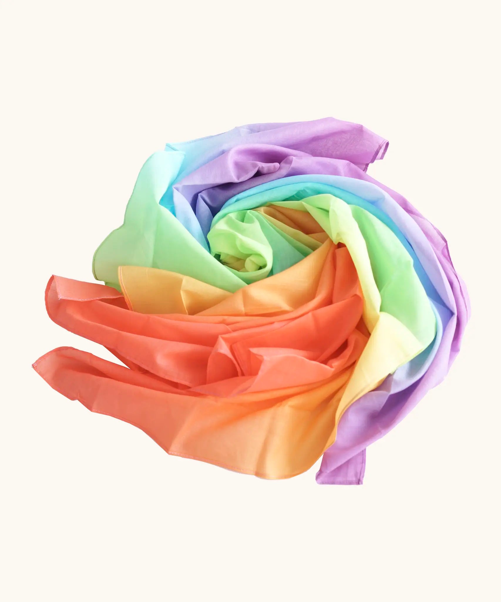Laura's play cotton pastel rainbow play cloth made from 100% organic cotton ruffled up into a pile