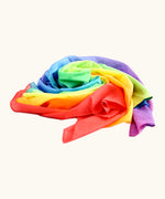 Laura's play cotton bright rainbow play cloth made from 100% organic cotton in  a pile