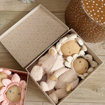 The Olli Ella Limited Edition Blossom Buds Gift Set - Gardenia, showing the Tootsie Gardenia & Dinky Dinkum Doll - Gracie Gardenia inside their gift box, on a wooden floor