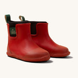 Little Green Radicals ankle wellington boots in red available at Babipur. A natural rubber wellington boot in red with a black elasticated ankle cuff and a green tab on the back.