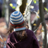 Back of child's head wearing a Little Green Radicals Fairtrade Knit Beanie in blue and cream stripes - made with GOTS organic cotton - shop now at Babipur.