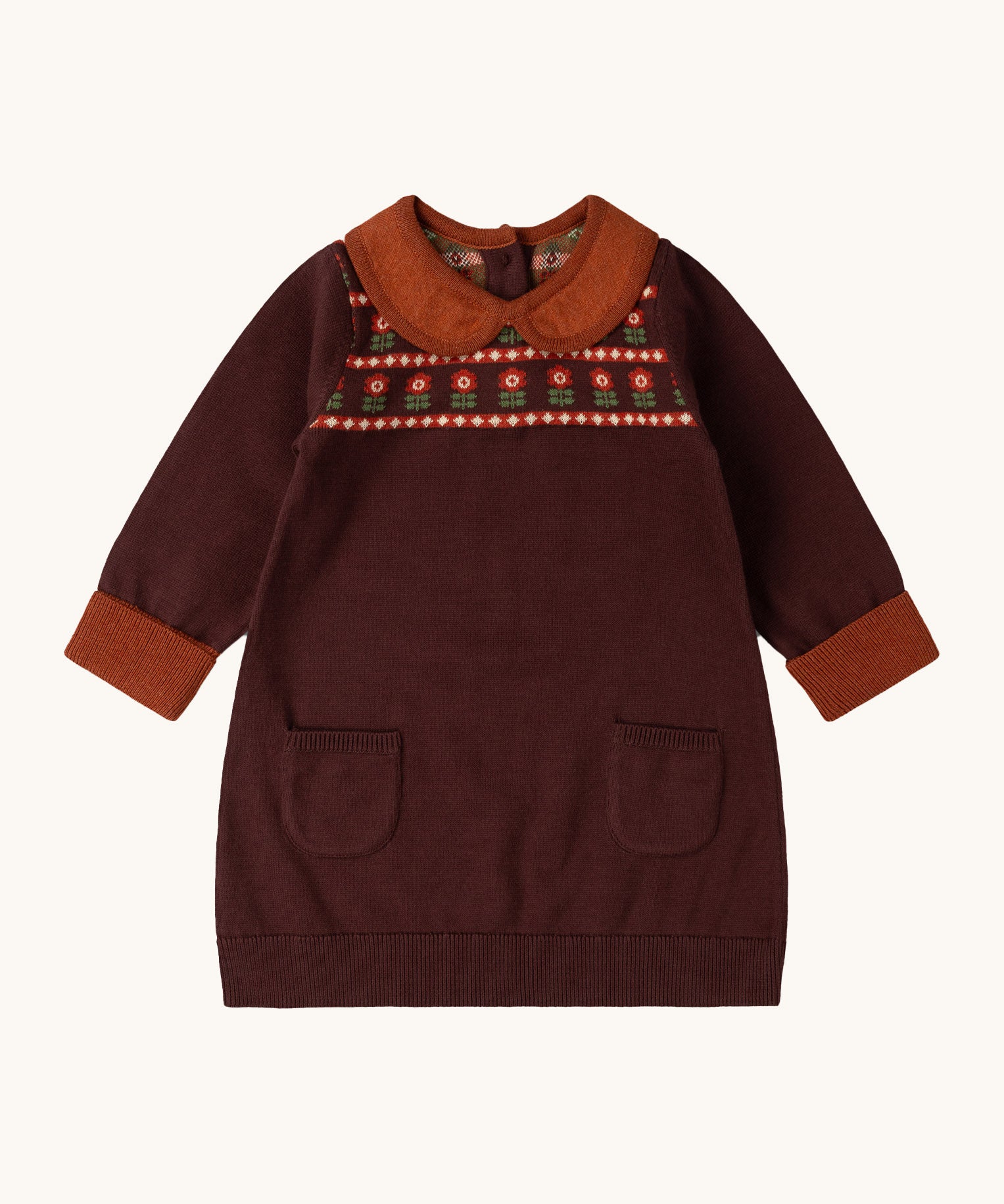 Little Green Radicals collecting flowers knitted collar dress available at Babipur. A dark maroon dress with a light brown collar and cuff trim. Features 2 side pockets and a cute retro flower design on the top