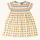 Little Green Radicals vintage style cream rainbows easy peasy summer toddler dress. A cream rainbow striped body with a skirt featuring a repeat nature themed pattern.