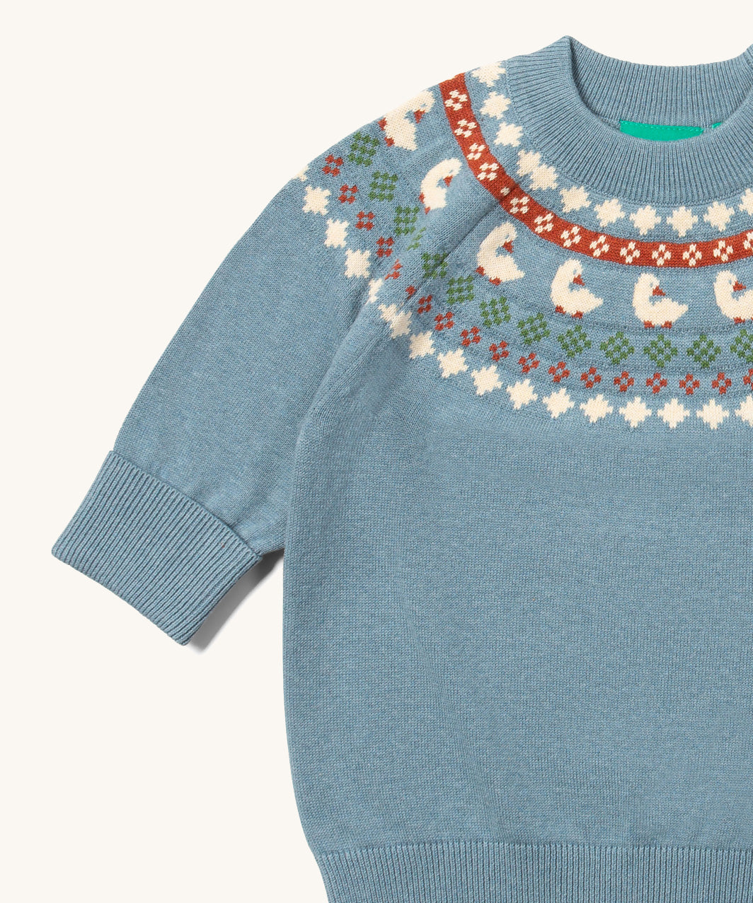 A close up of the Little Green Radicals fairisle knitted jumper in little ducks available at Babipur showing the fairisle design and elasticated cuff detail.
