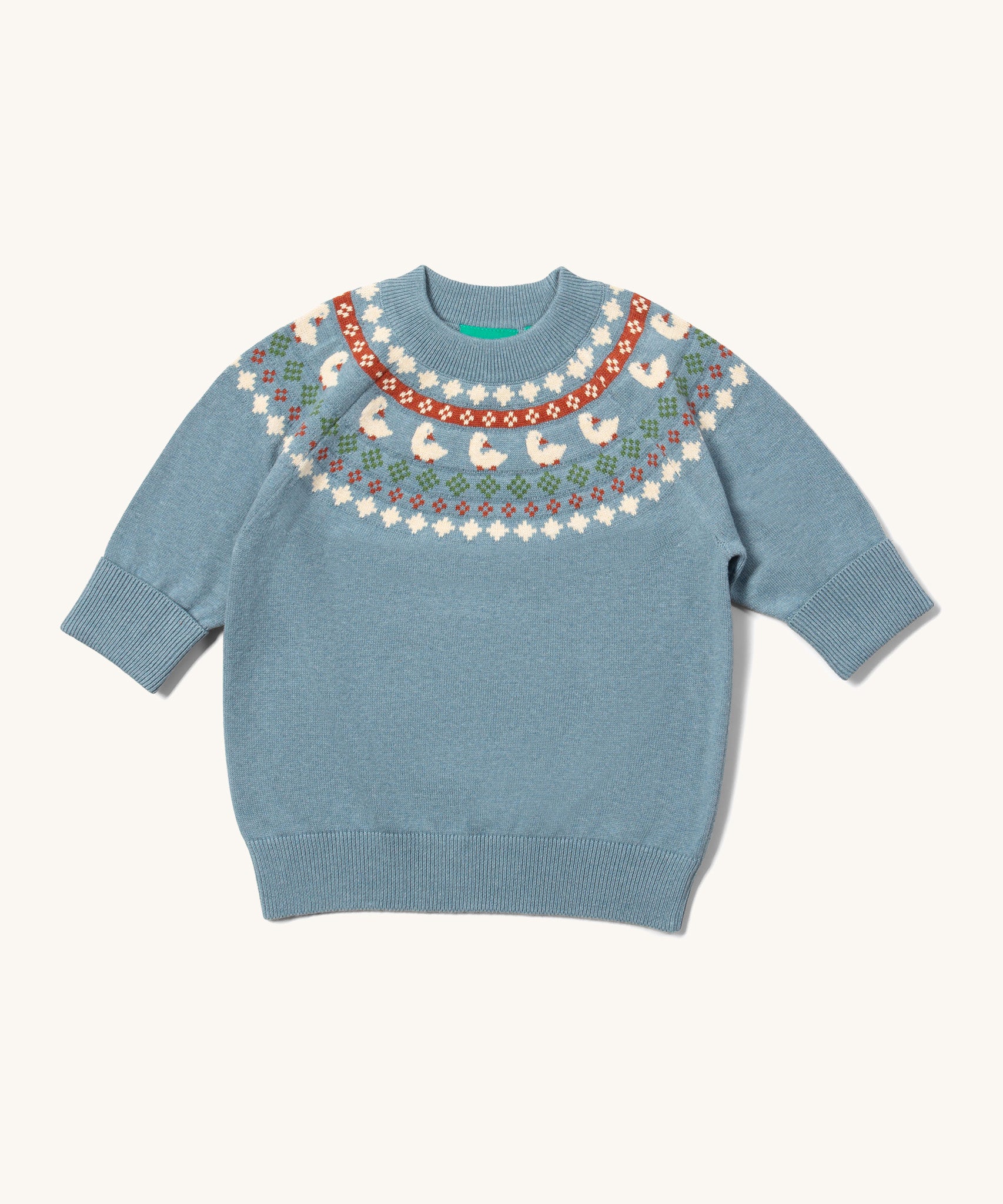 Little Green Radicals fairisle knitted jumper in little ducks available at Babipur. A GOTS organic cotton jumper in a soft knit style in light blue with a little duck fairisle design on the top. Features soft elasticated cuffs and hem for a comfortable fit.
